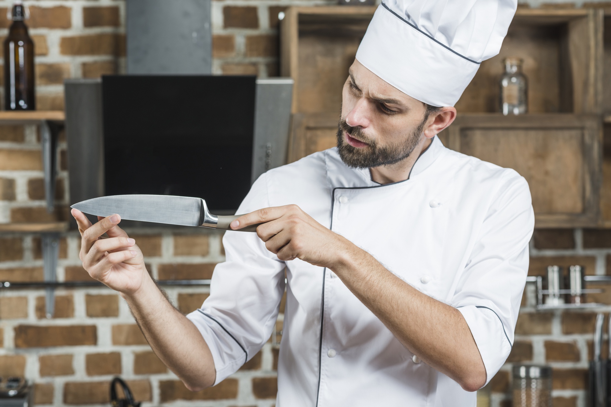 Instructor demonstrating knife skills in kitchen